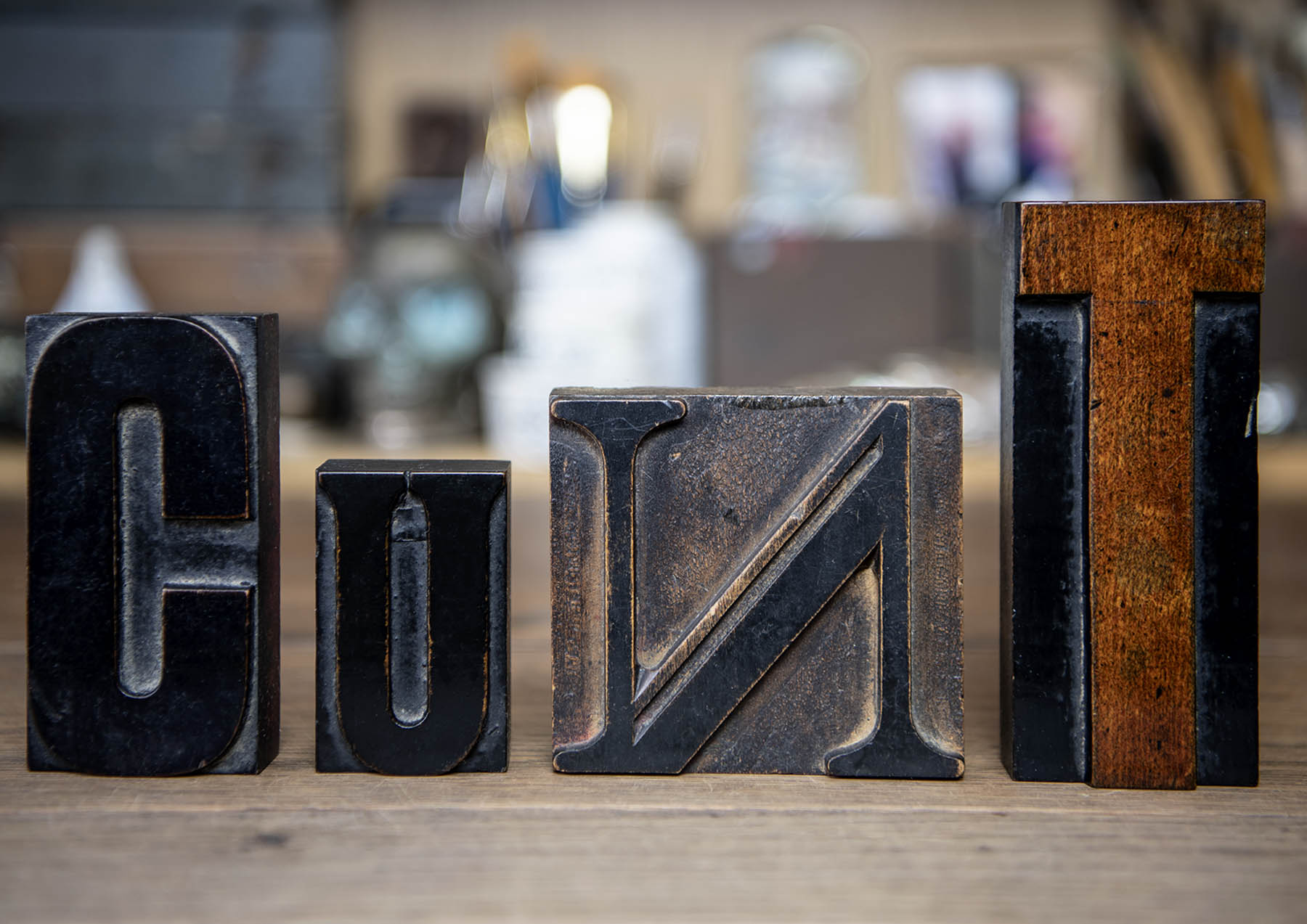 Vintage wooden printing blocks spell cunt