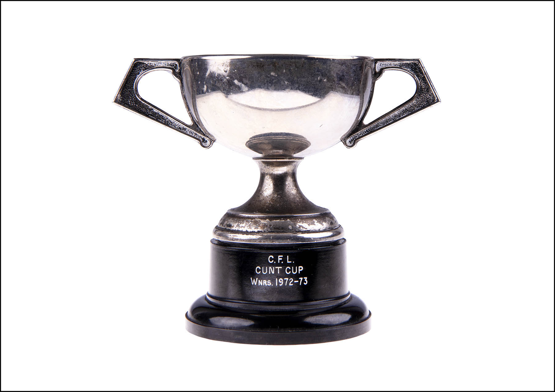 Silver plate cup trophy with CFL CUNT CUP WNRS. 1972-73 printed on base