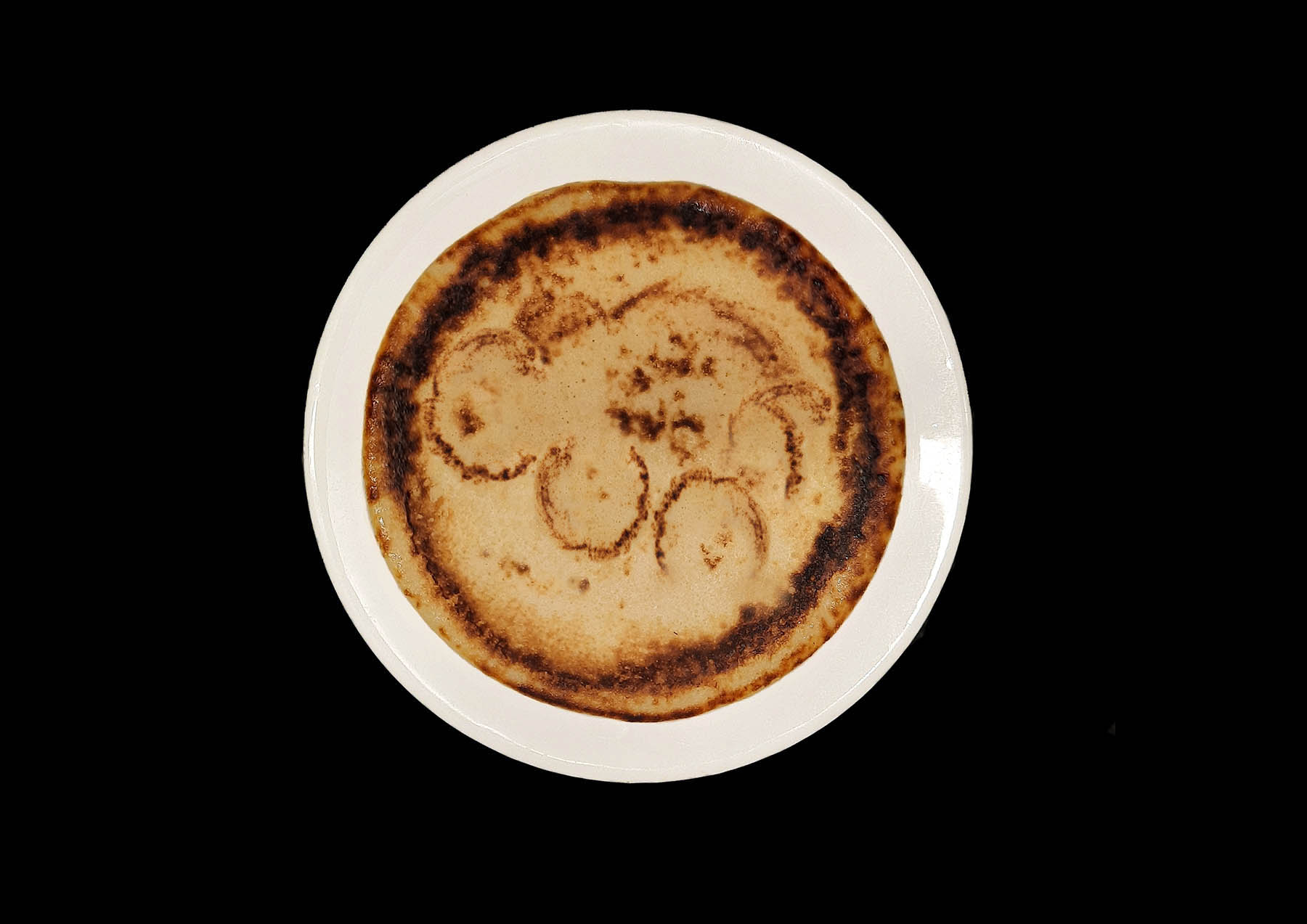 Pancake with cunt burnt into the surface