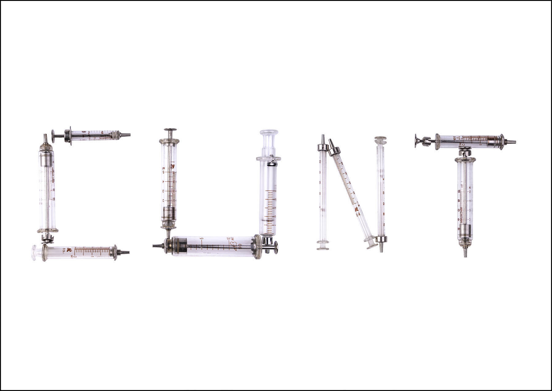 Vintage glass syringes spell cunt